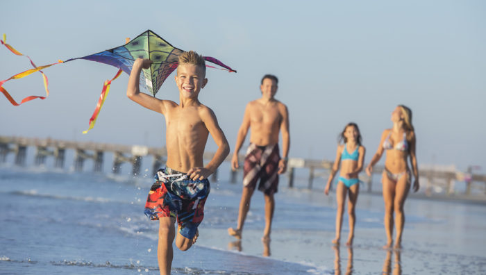 Family on the Beach with a Kite