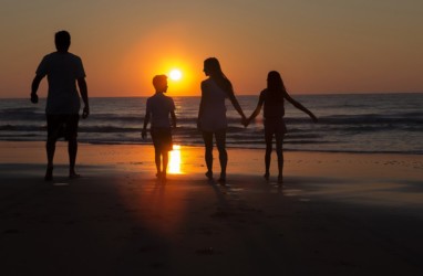 Family in Myrtle Beach at sunrise